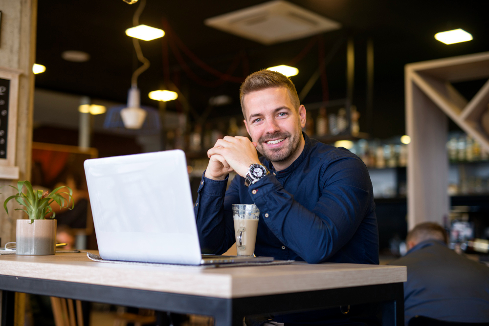 Entrepreneur Starting a New Limited Company Business owner using a laptop while setting up a new company